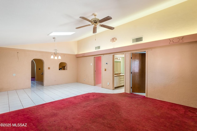 908 E Weymouth St, Tucson, AZ 85719 - empty room with vaulted ceiling, arched walkways, a ceiling fan, and light tile patterned floors