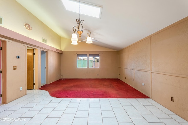 908 E Weymouth St, Tucson, AZ 85719 - spare room featuring vaulted ceiling, light carpet, and a chandelier