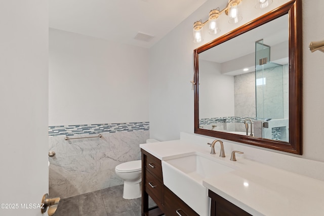 9510 E Danforth Pl, Tucson, AZ 85747 - full bath featuring toilet, vanity, tile walls, a shower, and tile patterned flooring