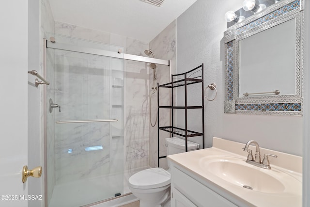 9510 E Danforth Pl, Tucson, AZ 85747 - full bath featuring a textured wall, toilet, a stall shower, and vanity