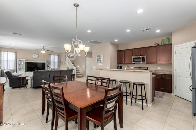 102 E Forrest Feezor St, Vail, AZ 85641 - dining area featuring ceiling fan, light tile patterned flooring, a chandelier, stairs, and recessed lighting