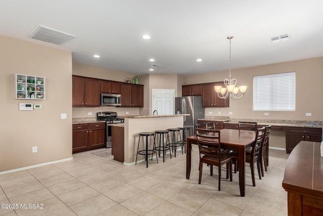 102 E Forrest Feezor St, Vail, AZ 85641 - dining room with a chandelier, baseboards, recessed lighting, and light tile patterned floors