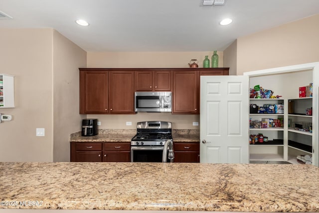 102 E Forrest Feezor St, Vail, AZ 85641 - kitchen featuring appliances with stainless steel finishes, light stone counters, and recessed lighting