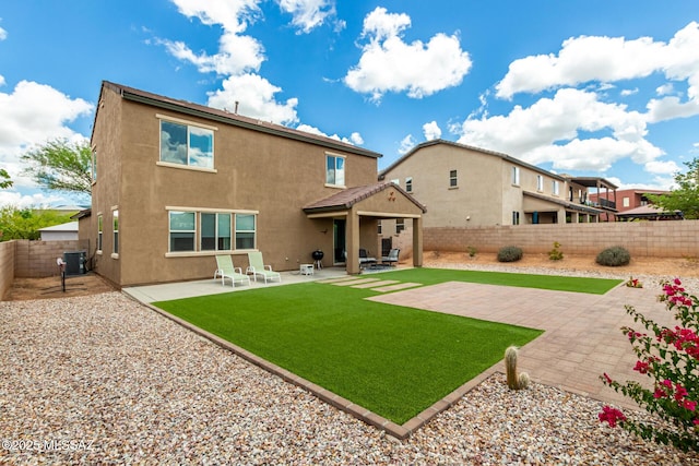 102 E Forrest Feezor St, Vail, AZ 85641 - back of house with stucco siding, a fenced backyard, cooling unit, and a patio
