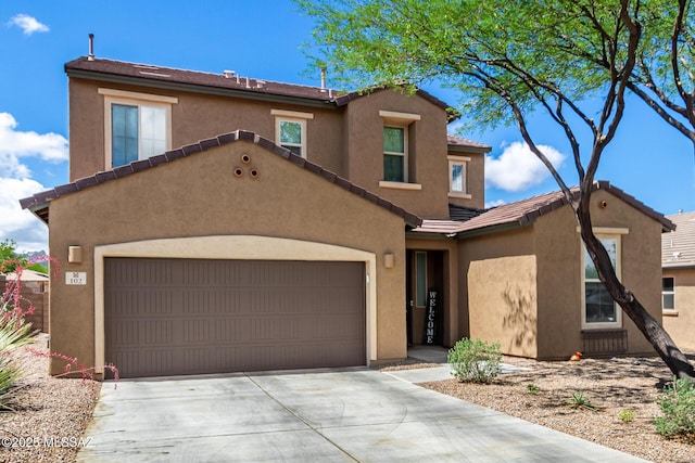102 E Forrest Feezor St, Vail, AZ 85641 - view of front of home featuring driveway, stucco siding, and a garage