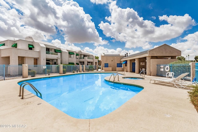 7916 E Colette Cir Unit 51, Tucson, AZ 85710 - community pool featuring a hot tub and a patio area