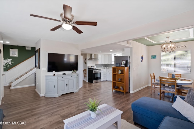 745 N Las Flores Dr, Oracle, AZ 85623 - living area with stairs, ceiling fan, wood finished floors, a chandelier, and recessed lighting