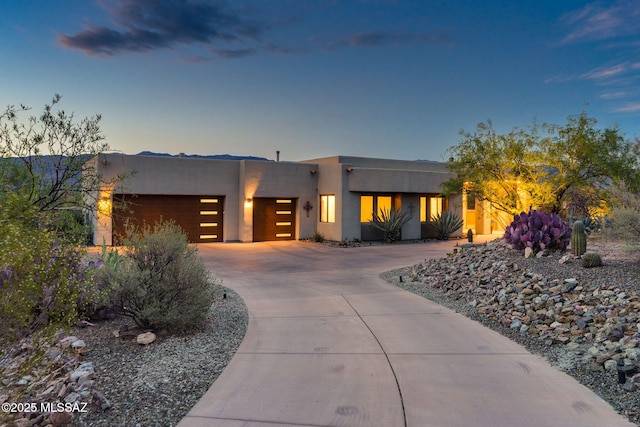 8505 S Circle C Ranch Rd, Vail, AZ 85641 - pueblo-style home featuring a garage, stucco siding, and driveway