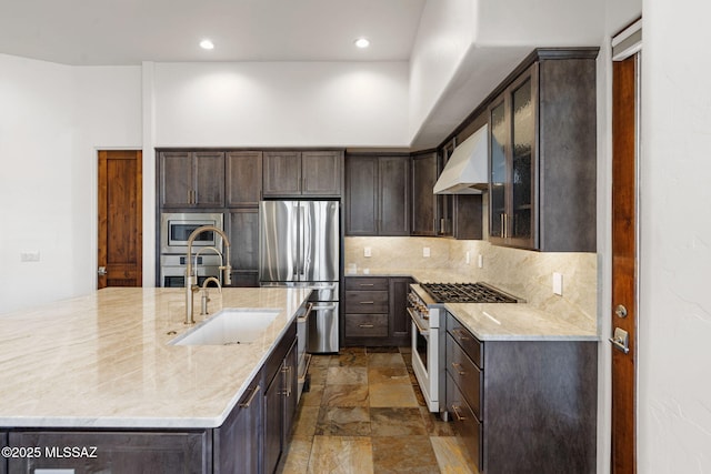 8505 S Circle C Ranch Rd, Vail, AZ 85641 - kitchen with stainless steel appliances, custom exhaust hood, dark brown cabinets, tasteful backsplash, and a sink