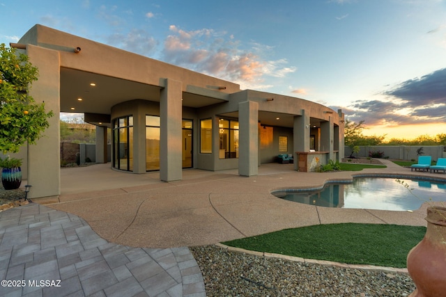 8505 S Circle C Ranch Rd, Vail, AZ 85641 - back of house with stucco siding and a patio area