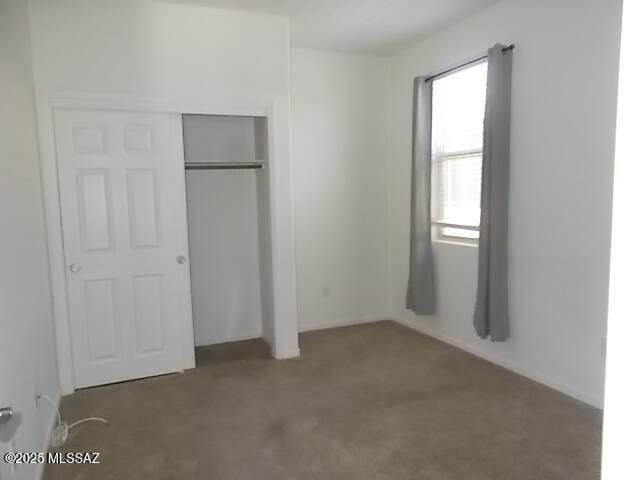 902 W Calle Tipoy, Sahuarita, AZ 85629 - unfurnished bedroom with a closet and carpet