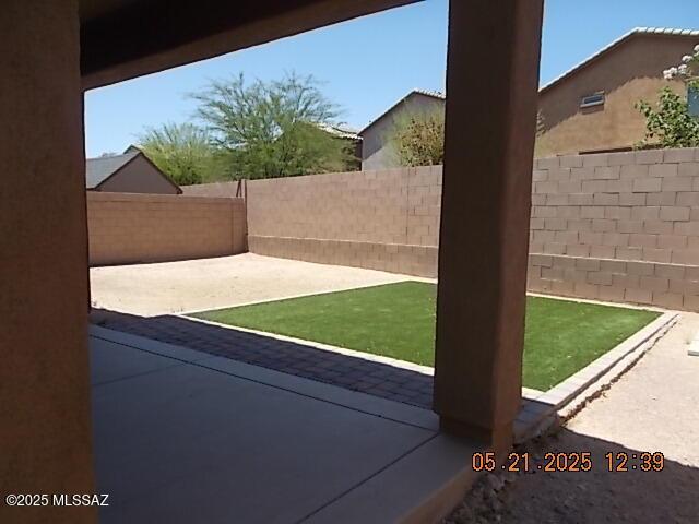902 W Calle Tipoy, Sahuarita, AZ 85629 - fenced backyard featuring a patio area