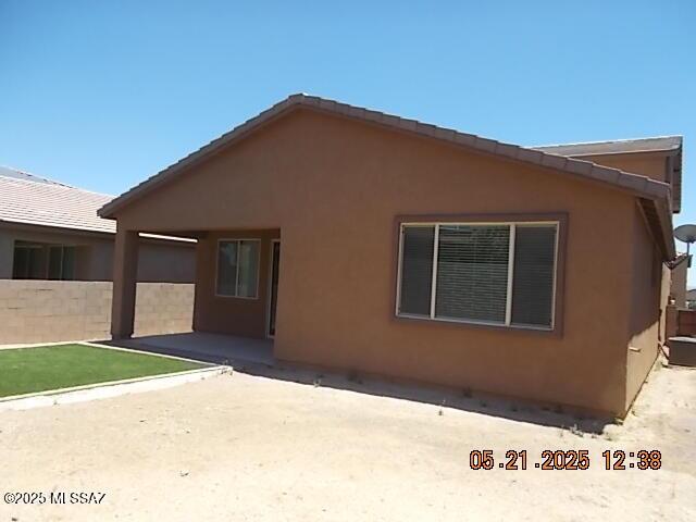 902 W Calle Tipoy, Sahuarita, AZ 85629 - back of house featuring a patio area and stucco siding