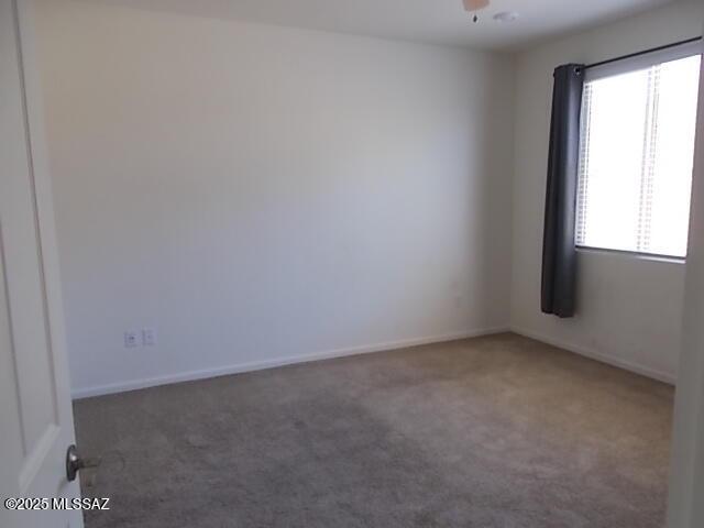 902 W Calle Tipoy, Sahuarita, AZ 85629 - carpeted spare room with baseboards