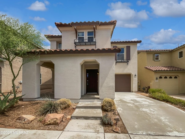 7637 E Cholla Overlook Dr, Tucson, AZ 85710 - mediterranean / spanish-style home with concrete driveway, a garage, and a tiled roof