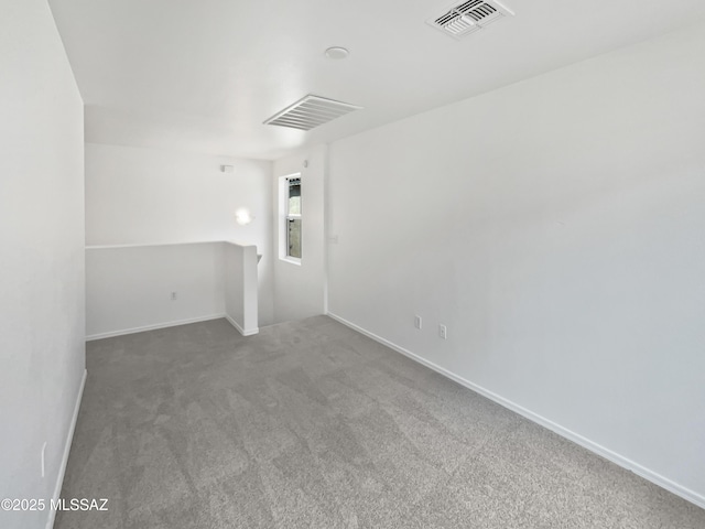 7637 E Cholla Overlook Dr, Tucson, AZ 85710 - unfurnished room featuring carpet flooring and baseboards