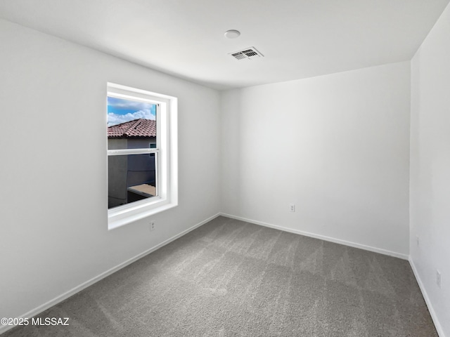 7637 E Cholla Overlook Dr, Tucson, AZ 85710 - carpeted empty room with baseboards