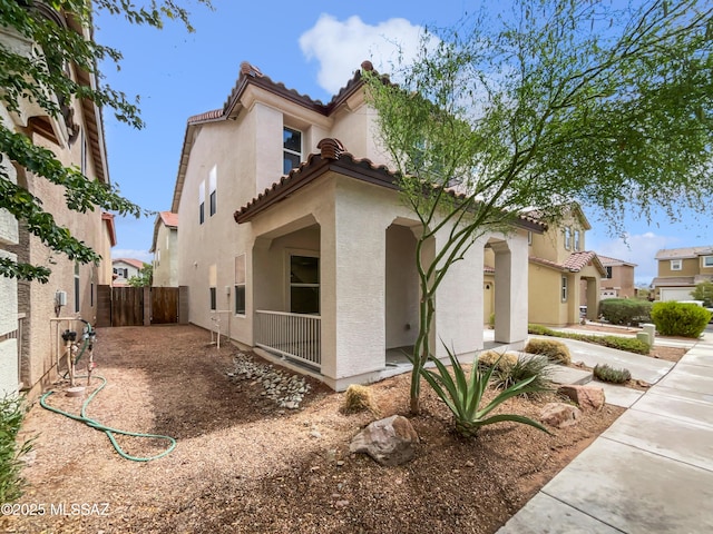 7637 E Cholla Overlook Dr, Tucson, AZ 85710 - view of front facade with a tile roof and stucco siding