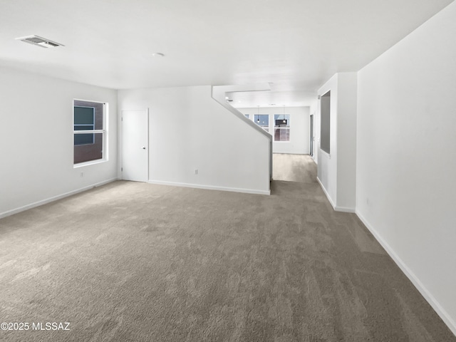 7637 E Cholla Overlook Dr, Tucson, AZ 85710 - empty room featuring carpet and baseboards