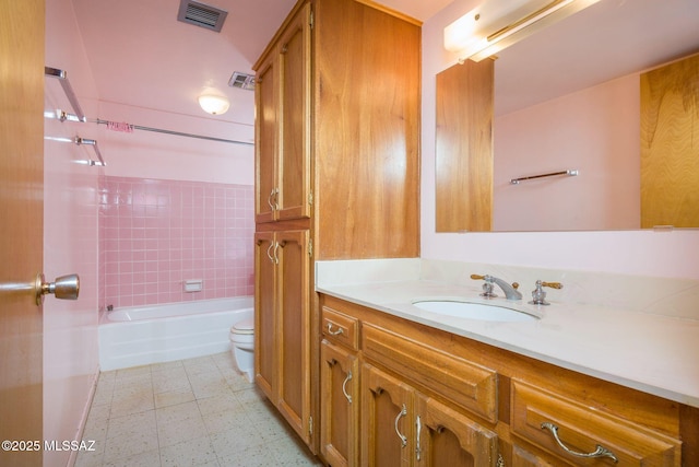 6532 N Cibola Ave, Tucson, AZ 85718 - bathroom featuring toilet, vanity, washtub / shower combination, and tile patterned floors