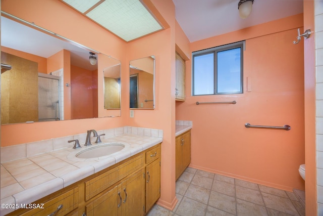 6532 N Cibola Ave, Tucson, AZ 85718 - full bath with an enclosed shower, vanity, baseboards, and toilet