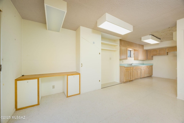 6532 N Cibola Ave, Tucson, AZ 85718 - kitchen with a sink, a textured ceiling, light countertops, and light brown cabinets