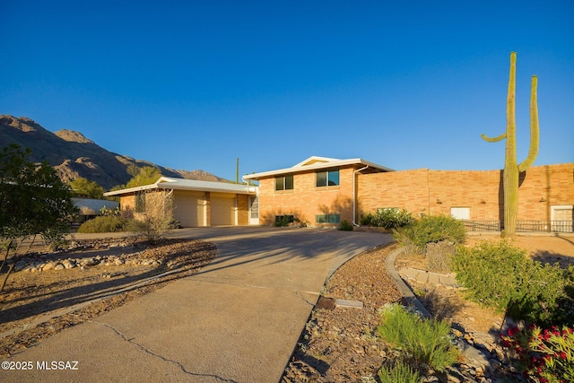 6532 N Cibola Ave, Tucson, AZ 85718 - view of front of home featuring a mountain view and brick siding