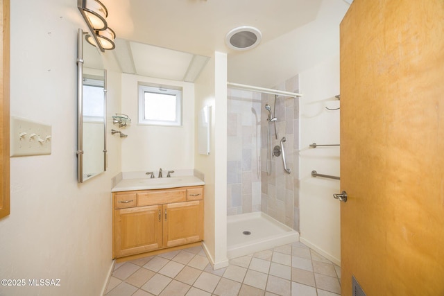 6532 N Cibola Ave, Tucson, AZ 85718 - full bathroom featuring tile patterned floors, tiled shower, vanity, and baseboards