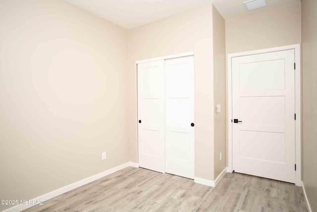 3601 E Nebraska Stra, Tucson, AZ 85706 - unfurnished bedroom with light wood finished floors and a closet