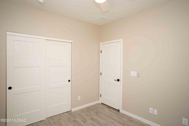 3601 E Nebraska Stra, Tucson, AZ 85706 - unfurnished bedroom with light wood-style flooring and a closet