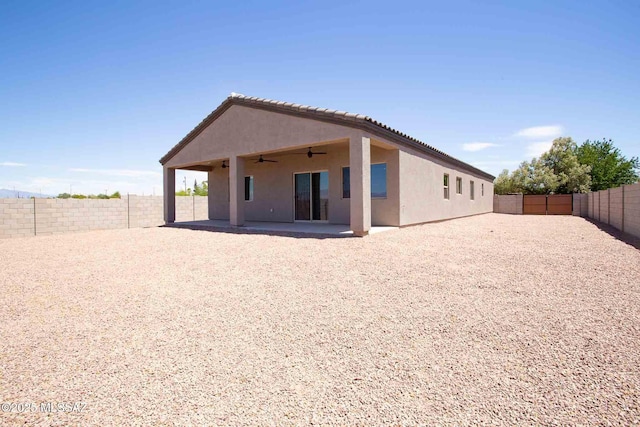 3601 E Nebraska Stra, Tucson, AZ 85706 - back of property featuring ceiling fan, stucco siding, a patio area, and a fenced backyard