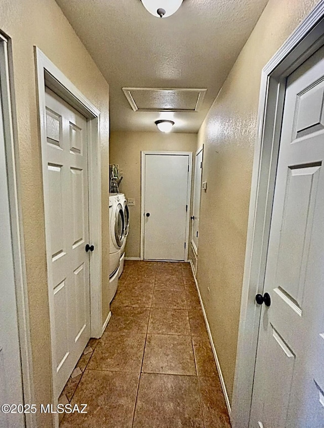 1643 W Houchin Way, Tucson, AZ 85746 - washroom with washer and clothes dryer, a textured ceiling, tile patterned floors, attic access, and a textured wall