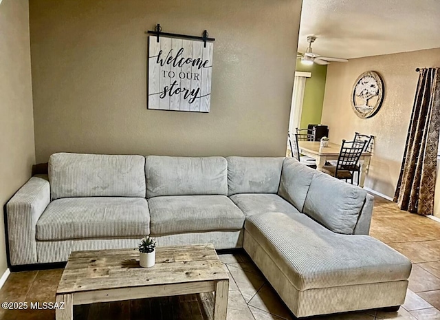 1643 W Houchin Way, Tucson, AZ 85746 - living room featuring ceiling fan, a textured wall, and tile patterned floors