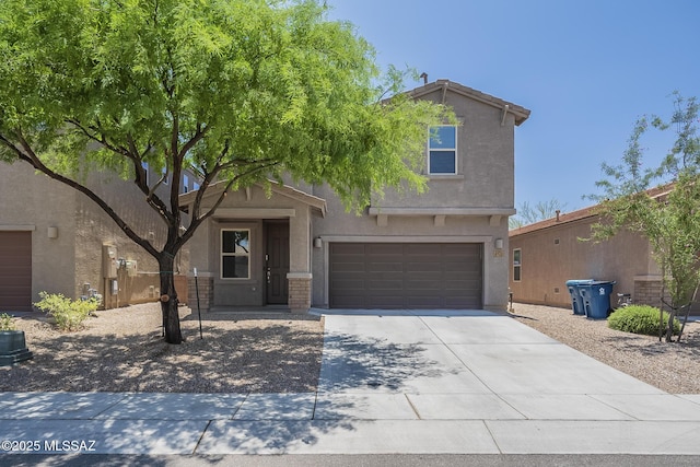 662 N Tree Mist Ln, Sahuarita, AZ 85629 - view of front of property featuring driveway, stucco siding, and an attached garage