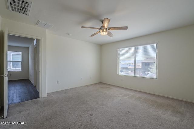 662 N Tree Mist Ln, Sahuarita, AZ 85629 - empty room featuring carpet floors, ceiling fan, and baseboards
