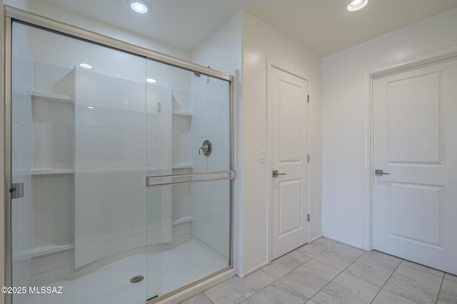 662 N Tree Mist Ln, Sahuarita, AZ 85629 - bathroom featuring a stall shower, tile patterned flooring, and recessed lighting