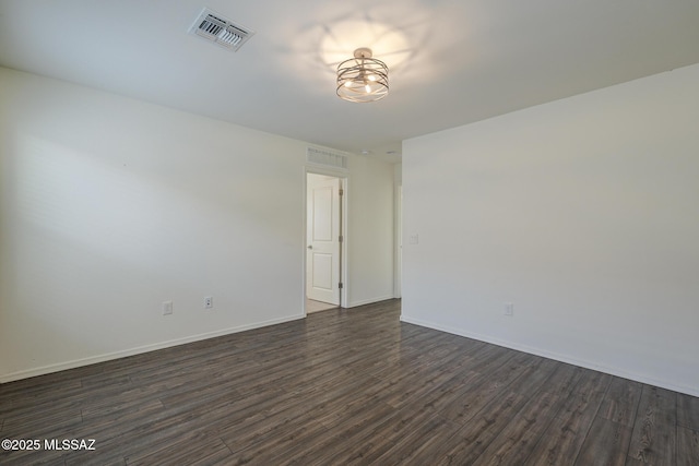 662 N Tree Mist Ln, Sahuarita, AZ 85629 - unfurnished room featuring dark wood-type flooring and baseboards