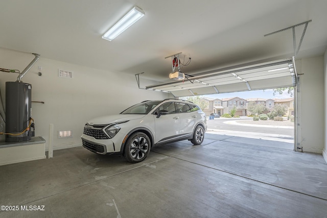 662 N Tree Mist Ln, Sahuarita, AZ 85629 - garage with water heater and a garage door opener