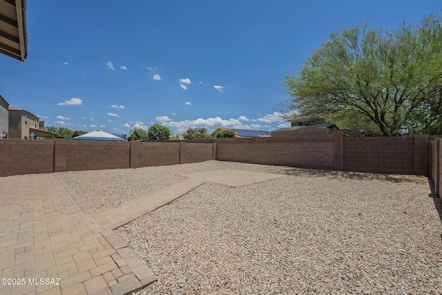 662 N Tree Mist Ln, Sahuarita, AZ 85629 - fenced backyard with a patio area