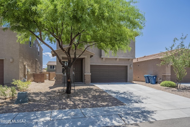 662 N Tree Mist Ln, Sahuarita, AZ 85629 - view of front of property featuring stucco siding, driveway, and an attached garage