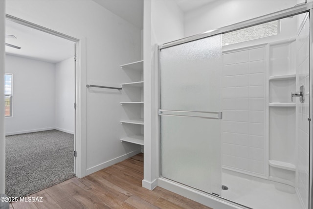 12767 E Giada Dr, Vail, AZ 85641 - full bath with a shower stall, wood finished floors, and baseboards