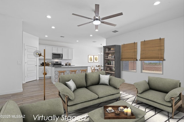12767 E Giada Dr, Vail, AZ 85641 - living area featuring recessed lighting, ceiling fan, light wood-style floors, and baseboards