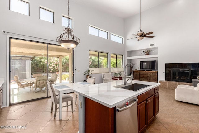 7397 W Crimson Ridge Dr, Marana, AZ 85743 - kitchen featuring open floor plan, dishwasher, light tile patterned flooring, ceiling fan, and a towering ceiling