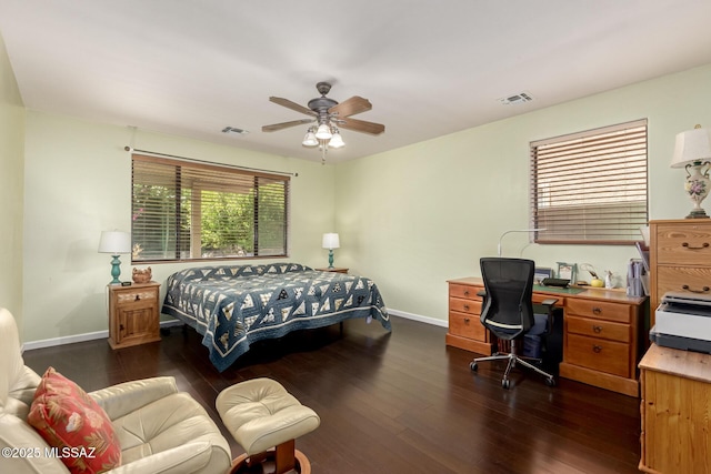 7397 W Crimson Ridge Dr, Marana, AZ 85743 - bedroom with dark wood finished floors, a desk, and a ceiling fan
