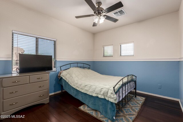 7397 W Crimson Ridge Dr, Marana, AZ 85743 - bedroom with dark wood-style floors, ceiling fan, and a closet