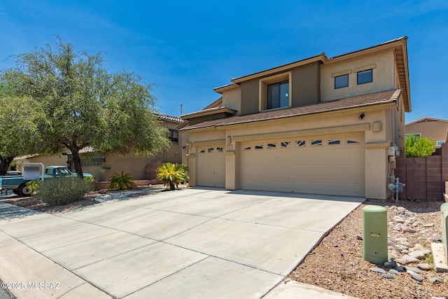 7397 W Crimson Ridge Dr, Marana, AZ 85743 - view of front of property with stucco siding, driveway, and a garage