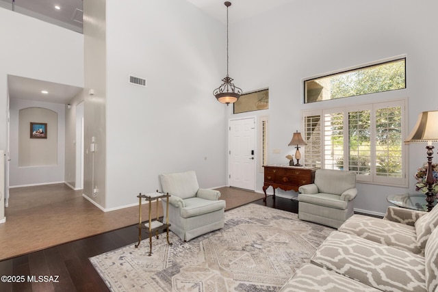 7397 W Crimson Ridge Dr, Marana, AZ 85743 - living area with a high ceiling, dark wood-style flooring, and recessed lighting