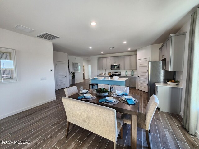 14139 E Canidae Dr E, Vail, AZ 85641 - dining area featuring dark wood-style floors, recessed lighting, and baseboards