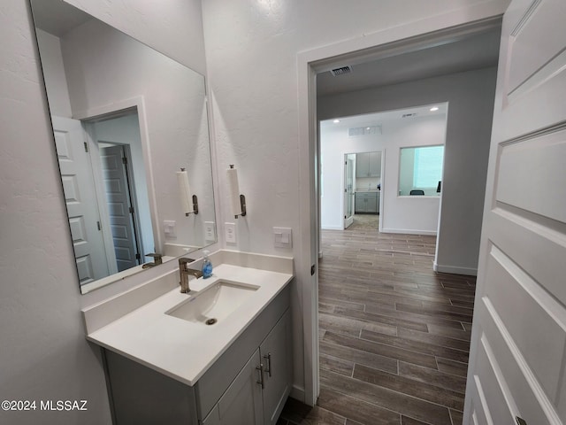 14139 E Canidae Dr E, Vail, AZ 85641 - bathroom with wood finished floors and vanity