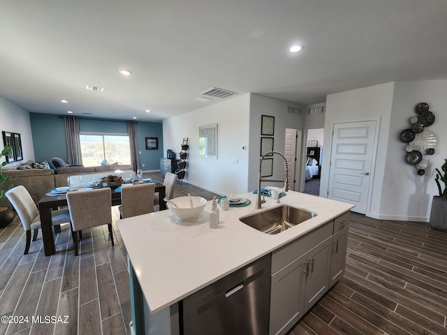 14139 E Canidae Dr E, Vail, AZ 85641 - kitchen with dishwasher, a sink, open floor plan, wood finish floors, and light countertops